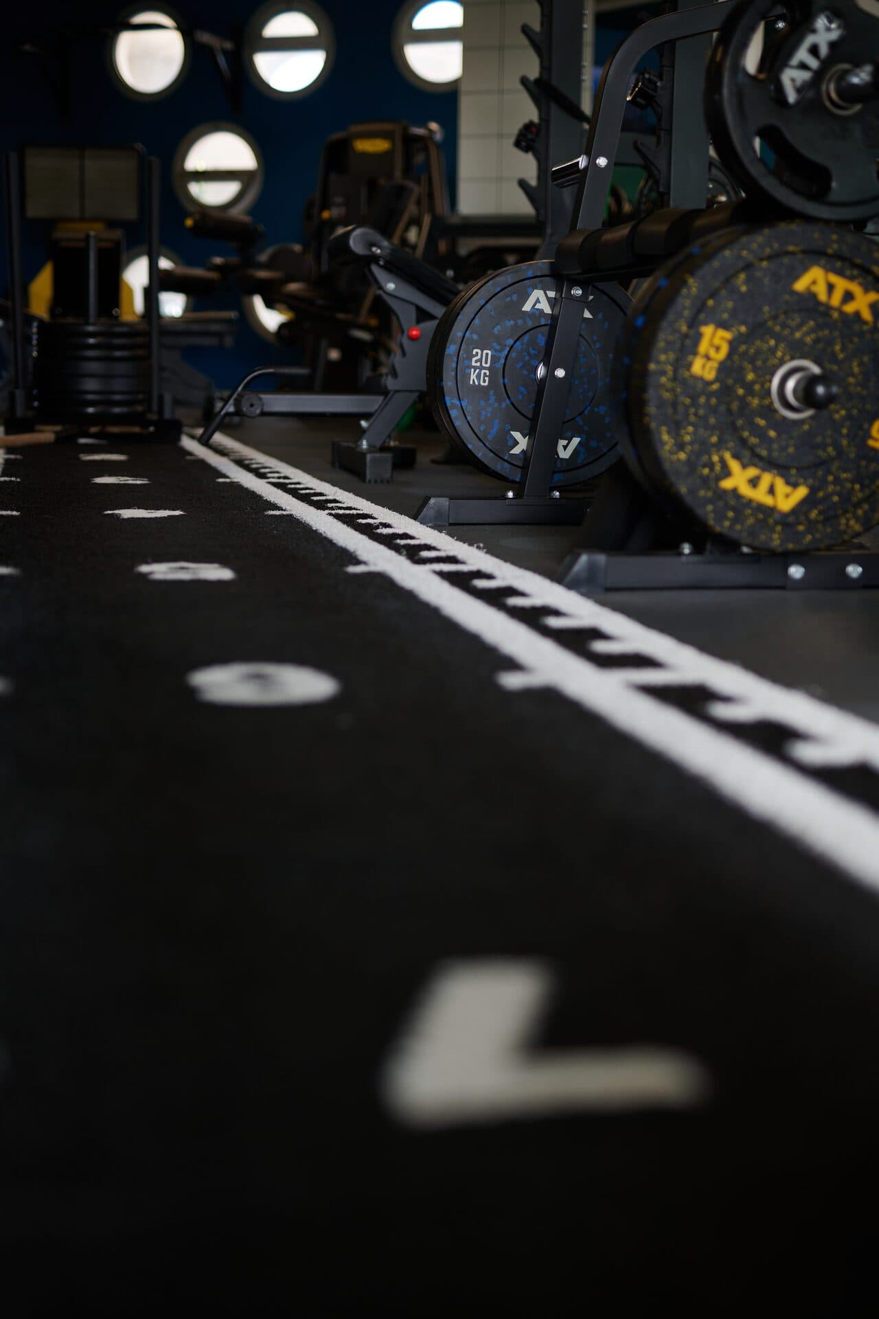 Hyrox training lane with weight plates